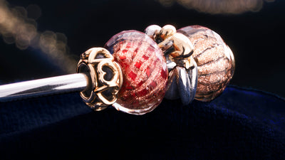 Trollbeads Armspange mit Glasbead, Silberbead und Goldbead