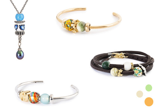 Vier verschiedene Arten von bunten Bead Armbändern auf weißem Hintergrund